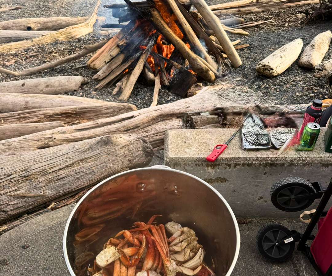 Campfire cooking during a SeaWind Aviation wilderness hunting trip